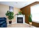 Detail shot of a fireplace with an electric firebox and a decorative mantle in the living room at 1288 Ivory Ct, Greenwood, IN 46143