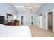 Spacious main bedroom with neutral carpet and access to the ensuite bath and walk-in closet at 1288 Ivory Ct, Greenwood, IN 46143
