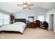 Bright main bedroom with a ceiling fan, neutral carpet, and large closet at 1288 Ivory Ct, Greenwood, IN 46143
