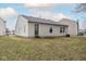 Back exterior view of a single-story house with a well-maintained lawn at 13446 N Carwood Ct, Camby, IN 46113