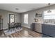 Charming dining area featuring stylish lighting, hardwood floors, and a modern table set at 13446 N Carwood Ct, Camby, IN 46113