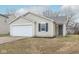 Charming single-story home with vinyl siding, a well-manicured lawn, and an attached one car garage at 13446 N Carwood Ct, Camby, IN 46113