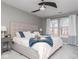 Serene main bedroom featuring soft carpeting, large windows, and a comfortable bed at 13446 N Carwood Ct, Camby, IN 46113