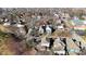 Aerial view of tree lined neighborhood with rooftops visible on sunny day at 1422 Carrollton Ave, Indianapolis, IN 46202