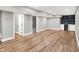 Spacious basement area with hardwood floors, recessed lighting, and a charming bar area at 1422 Carrollton Ave, Indianapolis, IN 46202