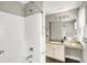 Bathroom with walk-in shower, sink with granite countertop, modern lighting, and neutral decor at 1422 Carrollton Ave, Indianapolis, IN 46202