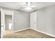 Standard bedroom with a ceiling fan, neutral paint, and carpet at 1422 Carrollton Ave, Indianapolis, IN 46202