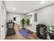 Finished basement showcasing a home gym, featuring a treadmill and weights at 1422 Carrollton Ave, Indianapolis, IN 46202