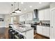 Eat-in kitchen with granite countertops, stainless steel appliances, and modern pendant lighting at 1422 Carrollton Ave, Indianapolis, IN 46202