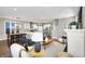 Open-concept living room with kitchen view, modern decor, and lots of natural light at 1422 Carrollton Ave, Indianapolis, IN 46202