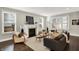 Bright living room with fireplace, hardwood floors, and modern decor at 1422 Carrollton Ave, Indianapolis, IN 46202