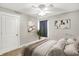 Cozy main bedroom featuring a window, modern art, ceiling fan, and a stylish décor at 1422 Carrollton Ave, Indianapolis, IN 46202
