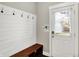 Mudroom featuring bench, hooks, and access to the exterior at 1422 Carrollton Ave, Indianapolis, IN 46202
