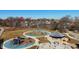 Overhead view of a public park with a playground, walking paths and picnic area at 1422 Carrollton Ave, Indianapolis, IN 46202