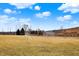 A soccer field with soccer goals sits in front of a privacy fence and a partly cloudy blue sky at 1422 Carrollton Ave, Indianapolis, IN 46202