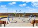 Community splash pad featuring playful water features and seating area for and families to enjoy at 1422 Carrollton Ave, Indianapolis, IN 46202