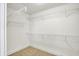 Walk-in closet equipped with white wire shelving for optimal storage at 1422 Carrollton Ave, Indianapolis, IN 46202