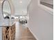 Bright entryway featuring wood-look floors, shiplap accent wall, and view of the dining room at 1439 Bellows Ave, Franklin, IN 46131