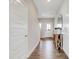 Welcoming entryway featuring wood-look floors, white paneled walls, and a rustic wood console table at 1439 Bellows Ave, Franklin, IN 46131