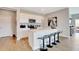 Bright kitchen with a large island, bar seating, stainless steel appliances and sleek, white cabinetry at 1439 Bellows Ave, Franklin, IN 46131