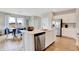 Bright kitchen featuring a large island, stainless steel appliances, and views into the dining area at 1439 Bellows Ave, Franklin, IN 46131