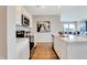 Well-lit kitchen with stainless appliances, stone countertops, and views into the living room at 1439 Bellows Ave, Franklin, IN 46131