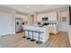 Modern kitchen features stainless steel appliances, a spacious island with bar seating and ample cabinet space at 1439 Bellows Ave, Franklin, IN 46131