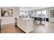 Open-concept kitchen and dining area with white cabinets, stainless appliances and lots of natural light at 1439 Bellows Ave, Franklin, IN 46131