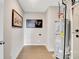 Utility room featuring water heater, artwork, and tiled floors at 1439 Bellows Ave, Franklin, IN 46131