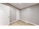 Neutral bedroom showcasing hardwood floors, closet space, and fresh paint at 1611 Elmhurst Dr, Indianapolis, IN 46219