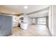 Modern kitchen with white cabinets, stainless steel appliances, and open floor plan at 1611 Elmhurst Dr, Indianapolis, IN 46219