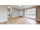Bright and airy living room with hardwood floors, large windows, and neutral paint colors at 1611 Elmhurst Dr, Indianapolis, IN 46219