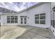 The patio features a smooth concrete surface with large windows and doors leading into the home at 16799 Imperial Ct, Fishers, IN 46040