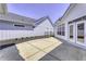 View of a concrete patio with a walkway and a small landscaped area, framed by the home's exterior at 16799 Imperial Ct, Fishers, IN 46040
