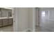 Hallway leading to bathroom featuring granite countertops at 16799 Imperial Ct, Fishers, IN 46040