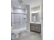 Bright bathroom featuring a tiled shower, modern vanity with a quartz countertop and chrome fixtures at 16799 Imperial Ct, Fishers, IN 46040