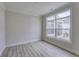 Bedroom featuring wood floors, a large window with backyard view and neutral paint colors at 16799 Imperial Ct, Fishers, IN 46040
