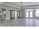 Bright dining room with sliding barn doors and chandelier lighting at 16799 Imperial Ct, Fishers, IN 46040