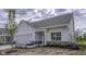 New home featuring a white exterior, attached garage, landscaped yard and tasteful stone facade accents at 16799 Imperial Ct, Fishers, IN 46040