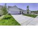 Beautiful home with a long driveway, lush green lawn, and inviting curb appeal at 16799 Imperial Ct, Fishers, IN 46040