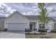 Beautiful new construction home with a white exterior, attached garage, and landscaped front yard at 16799 Imperial Ct, Fishers, IN 46040