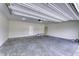 Spacious two-car garage with concrete flooring, access door to home, and overhead door at 16799 Imperial Ct, Fishers, IN 46040