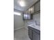 Functional laundry room with storage cabinets and sink at 16799 Imperial Ct, Fishers, IN 46040