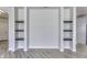 Living room featuring built-in shelving and modern flooring at 16799 Imperial Ct, Fishers, IN 46040