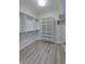 Walk-in closet with hardwood floors, shelving, and hanging rods at 16799 Imperial Ct, Fishers, IN 46040