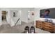 Second floor hallway with carpet and a view of the downstairs, with a TV at 16912 Sandhurst Pl, Westfield, IN 46074