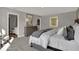 Spacious main bedroom with dresser, art, and plush bed with a view to the bath at 16954 Sandhurst Pl, Westfield, IN 46074