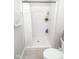 Standard shower stall with a white shower curtain, and built-in shelving at 17051 Rainier Cir, Westfield, IN 46062