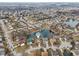 An aerial view shows a community surrounding a neighborhood pond at 1750 Quiet Haven Cir, Indianapolis, IN 46229
