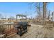 Spacious back deck with grill overlooking a serene pond, ideal for outdoor dining and relaxation at 1750 Quiet Haven Cir, Indianapolis, IN 46229